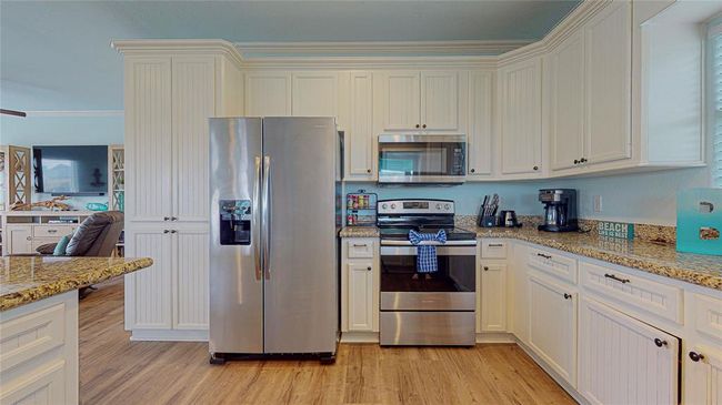 New microwave and a spacious refrigerator with an ice maker for added convenience. | Image 18