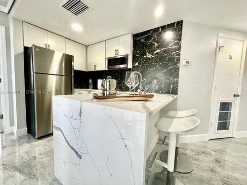 3302-6165 Carrier Dr, ORLANDO, FL, 32819-8254 | Card Image