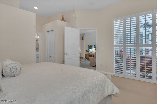 Carpeted bedroom featuring ensuite bath | Image 17