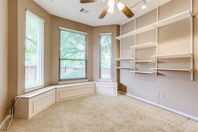 Secondary bedroom with shelving and extra storage. | Image 30