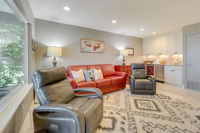Living room featuring healthy amount of natural light, recessed lighting, and light carpet | Image 19
