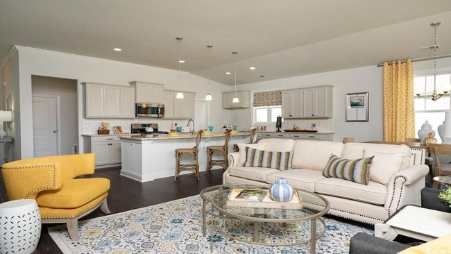 Living room featuring dark wood-type flooring, crown molding, plenty of natural light, and recessed lighting | Image 15