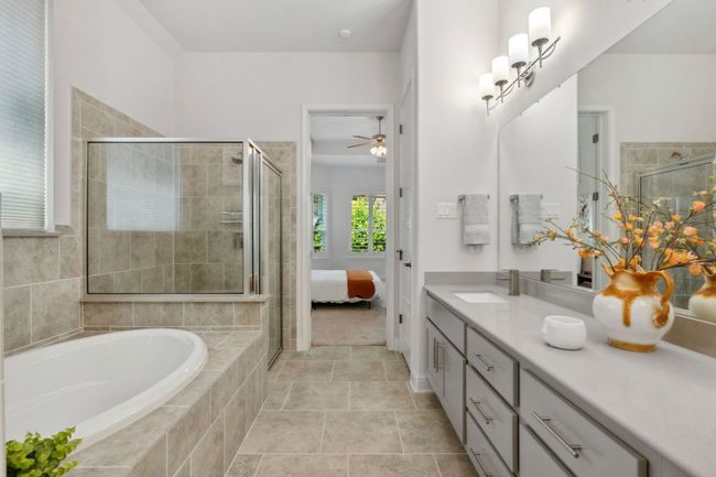 The ensuite is equipped with a separate tub and shower. | Image 23