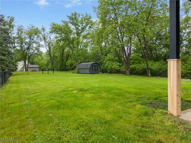 View of yard featuring a storage shed | Image 30