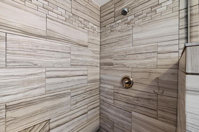 Bathroom with a tile shower | Image 22