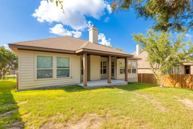 Back of house with a patio, a chimney, and roof with shingles | Image 27