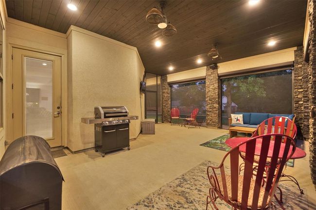 A stunning screened-in porch just off the living room makes it easy to extend your entertaining outdoors! Thoughtfully designed for convenience, it also features direct access to the back porch, creating a seamless flow between indoor and outdoor living spaces. | Image 35