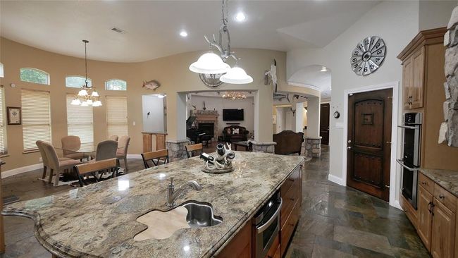 Large island in the kitchen with sink | Image 18