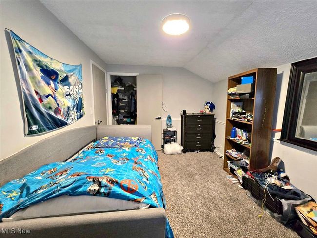 Bedroom with carpet flooring and vaulted ceiling | Image 40