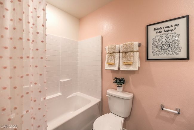 Bathroom featuring toilet and shower / bath combo | Image 32