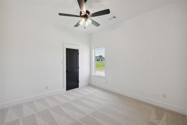 Unfurnished room featuring ceiling fan and light colored carpet | Image 24