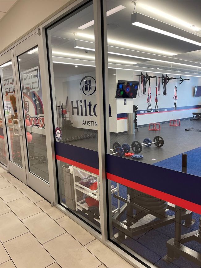 Workout area with tile patterned flooring | Image 15