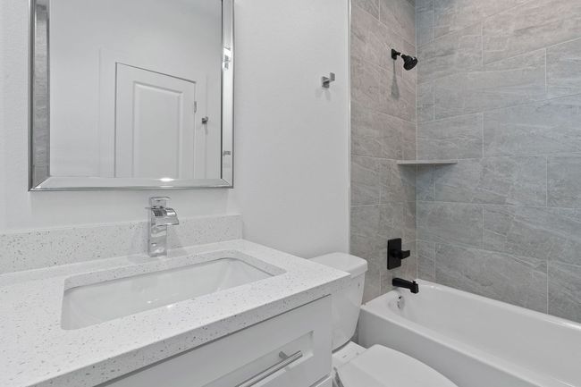 Bathroom with shower / tub combination, toilet, and vanity | Image 21