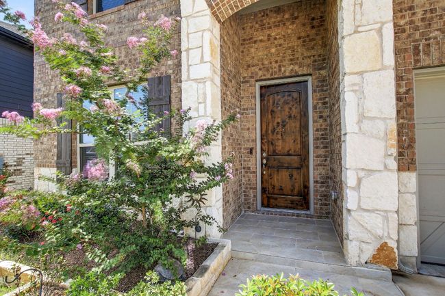 Property entrance with brick siding and stone siding | Image 4