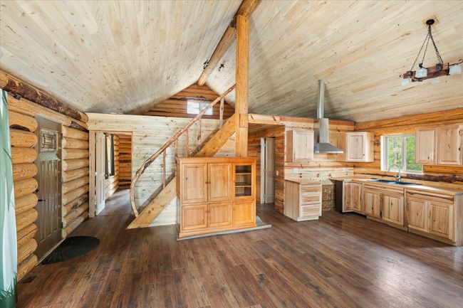 View of the guest cabin kitchen and stairs to the loft | Image 31