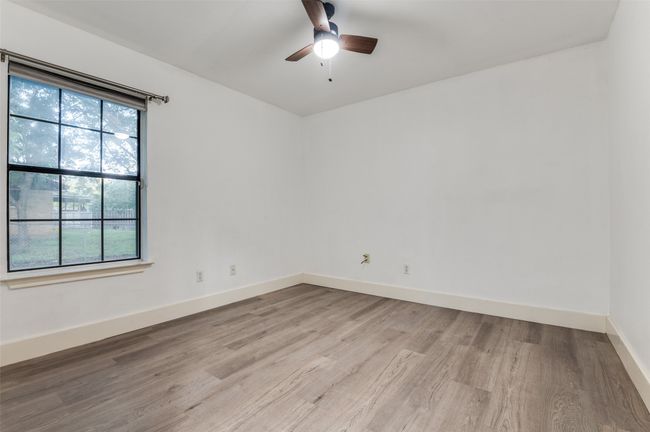 Unfurnished room featuring light wood-type flooring and a ceiling fan | Image 17