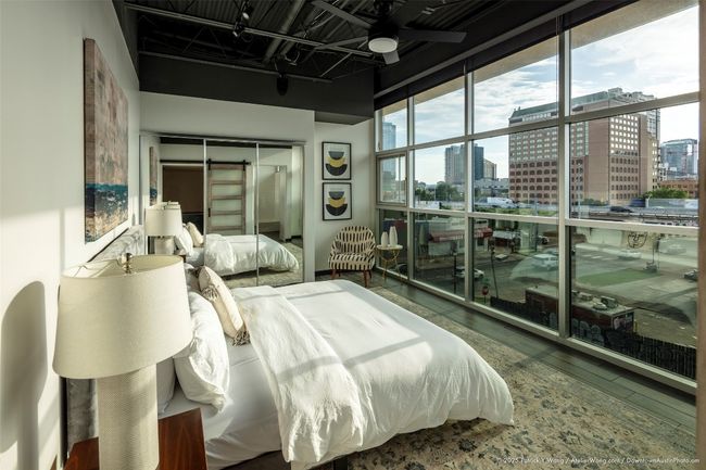Floor-to-ceiling window wall frames downtown view | Image 9