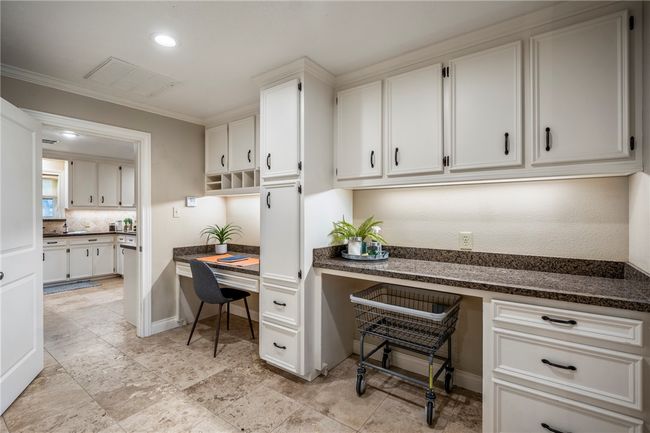 Home office featuring baseboards, visible vents, ornamental molding, built in desk, and recessed lighting | Image 20