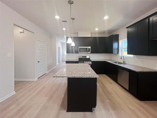 Kitchen from Dining Area. Home under construction. Sample floor plan photo used for illustrative purposes only. Upgrades, selections options, windows and colors may vary. | Image 5