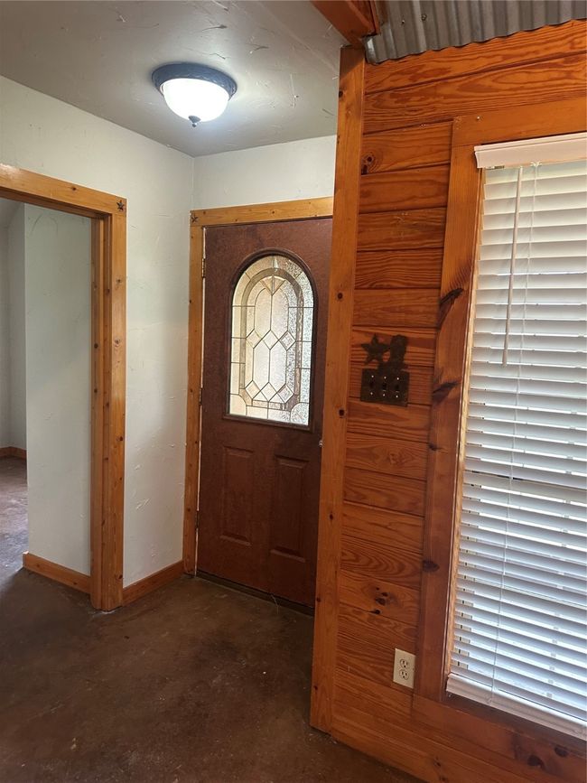 Foyer with concrete flooring and baseboards | Image 4