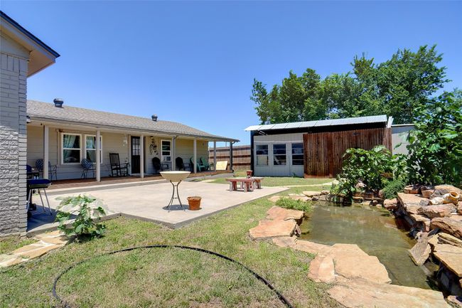Rear view of property with a patio and an outbuilding | Image 23