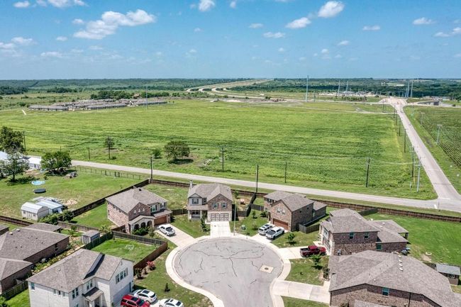 Aerial view of sparsely populated area with agricultural land | Image 36