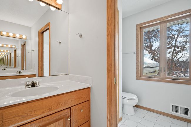 From this view you can see the second vanity and the pocket door separating the two spaces. This set up is great for busy mornings with multiple people getting ready at the same time. | Image 28