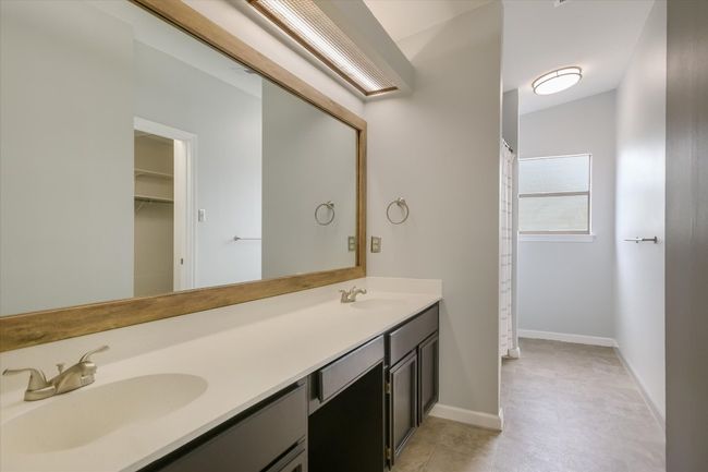 The owner's retreat is complete with a spacious ensuite bath. | Image 11