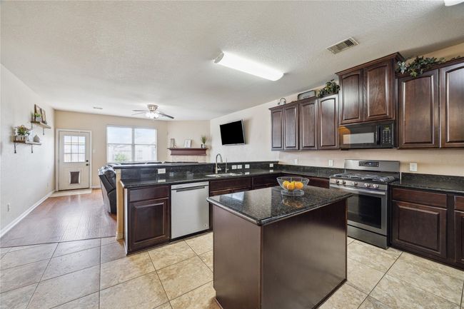 Kitchen opens up to family room | Image 9