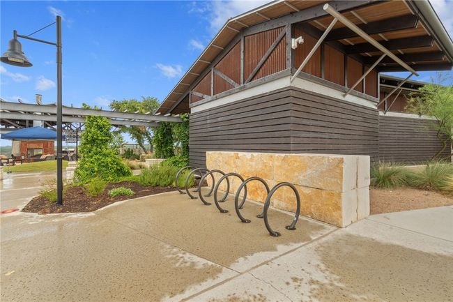 Amenity center has walking paths and bike racks. Ride your bike to the gym, or bike down one of the many biking and hiking trails in the neighborhood! LOTS AND LOTS OF GREEN SPACE and TRAILS TO EXPLORE!!! | Image 35