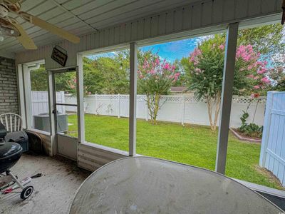 Unfurnished sunroom featuring ceiling fan | Image 2