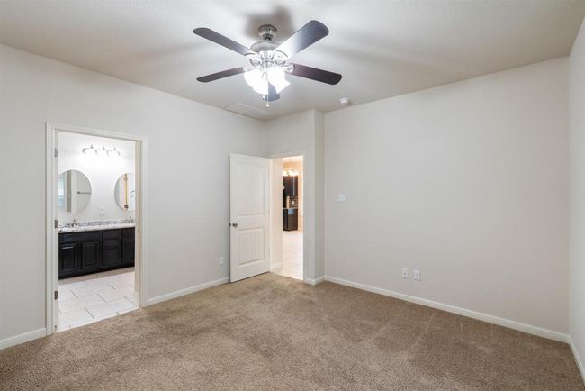 Door to the left leads to ensuite bathroom. | Image 23