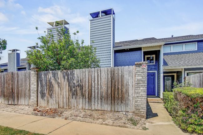 View of front of home with roof with shingles and a chimney | Image 18