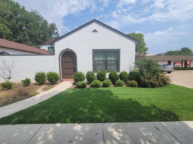 View of front of house with a front yard and stucco​​‌​​​​‌​​‌‌​‌‌​​​‌‌​​‌‌​‌​​​​​‌ siding | Image 5