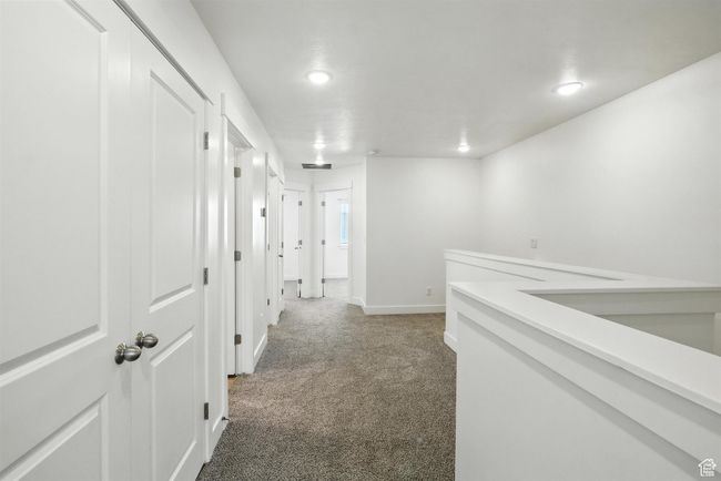 Corridor with carpet and recessed lighting | Image 9