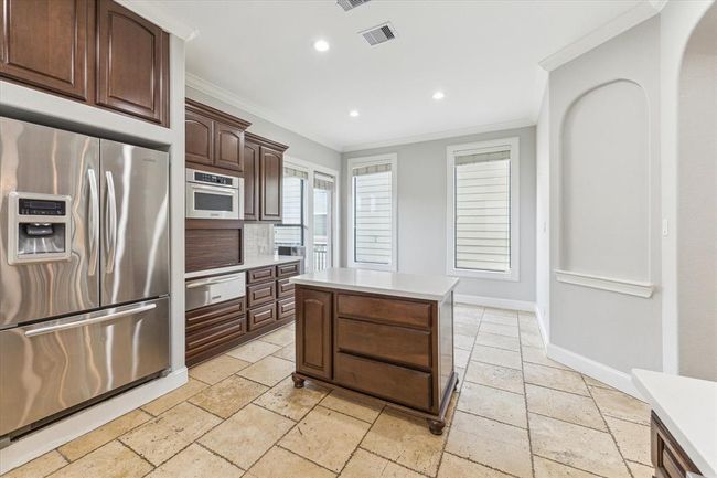 The kitchen flows effortlessly into the dinning area. Perfect for entertaining. | Image 13