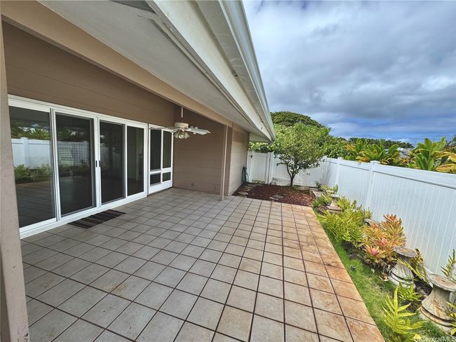 Fenced in patio, outside of primary bedroom's family room | Image 16