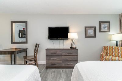 Bedroom with light wood-type flooring | Image 3