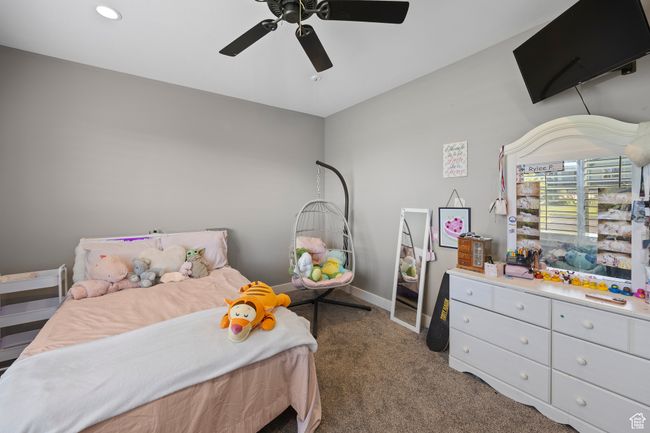 Bedroom featuring carpet flooring, a ceiling fan, baseboards, and recessed lighting | Image 44