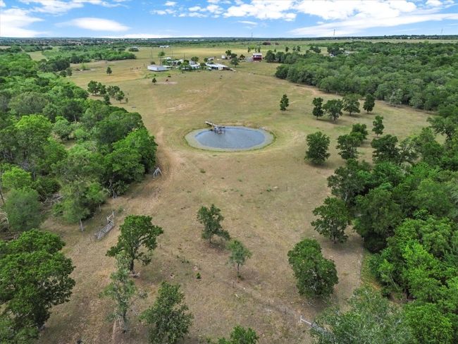 Tucked away on nearly 37 acres of peaceful Texas countryside, this one-of-a-kind property offers incredible versatility with over $250, 000 in improvements and four unique structures—making it the perfect canvas for a family compound, creative retreat, or income-producing estate. | Image 30