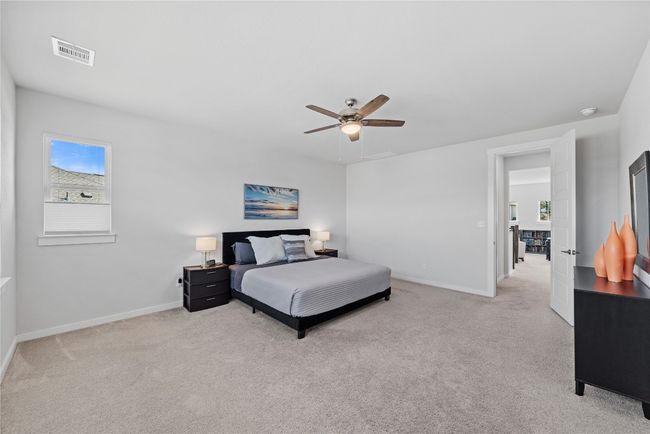 Bedroom with baseboards, visible vents, and carpet | Image 16