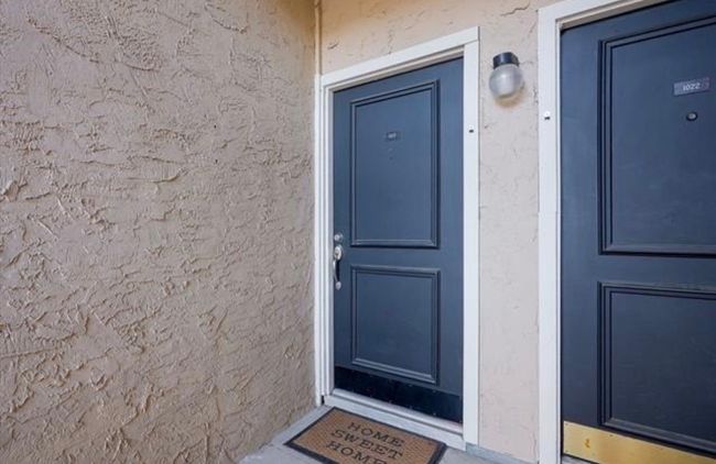 Entrance to property with stucco siding | Image 27