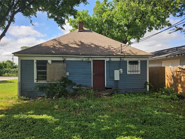 View of front facade with a chimney and a shingled roof | Image 4