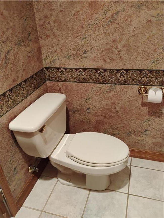 Downstairs half Bathroom with tile patterned flooring and toilet | Image 58