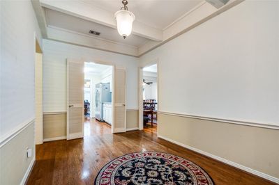 Hallway featuring hardwood / wood-style flooring and crown molding | Image 3