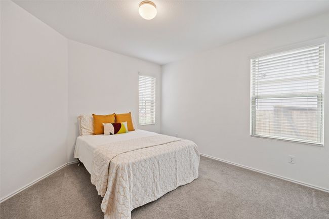 Carpeted bedroom featuring baseboards | Image 25