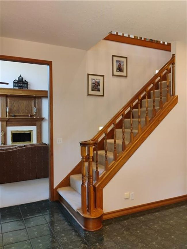 Staircase with baseboards and a fireplace | Image 27