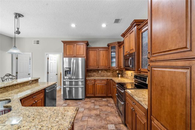Kitchen/Entry Way to1st Level 1/2 Bathroom and Laundry Room | Image 17