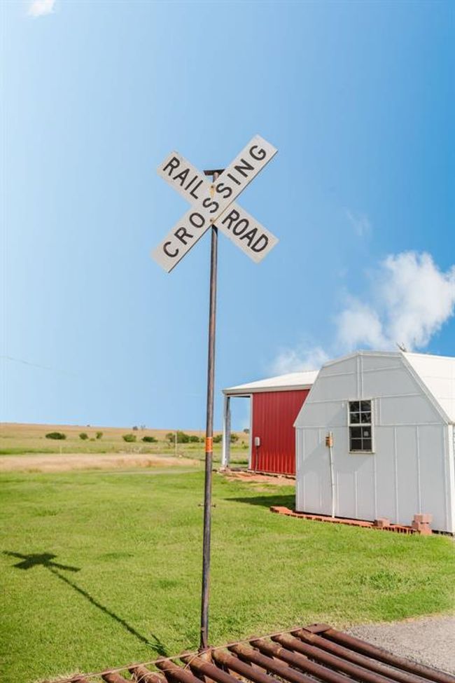 View of grassy yard featuring an outbuilding | Image 40