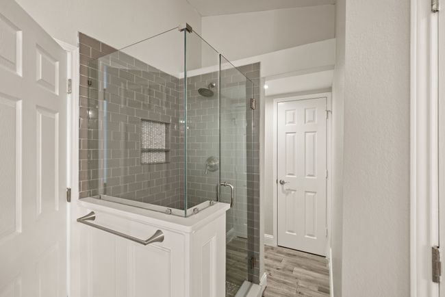 This sleek walk-in shower combines luxury and funcionality. | Image 27